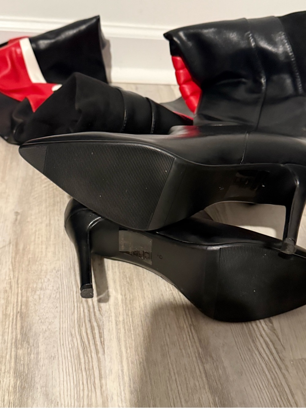 Women's Black Knee-High Stiletto Boots with Red Interior Accent